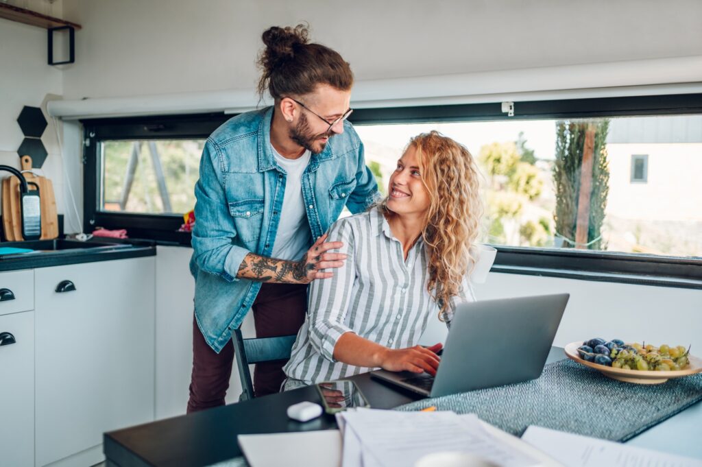 Couple working from home and spending time together in the kitchen